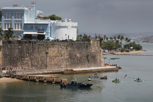 Protesters are seen on the water in personal water craft next to the governors mansion as they protest against Ricardo Rossello, the governor of Puerto Rico on July 19, 2019 in Old San Juan, Puerto Rico. Some of the protesters were playing loud Bad Bunny music from speakers. There have been calls for the governor to step down after it was revealed that he and top aides were part of a private chat group that contained misogynistic and homophobic messages. (Photo by Joe Raedle/Getty Images)